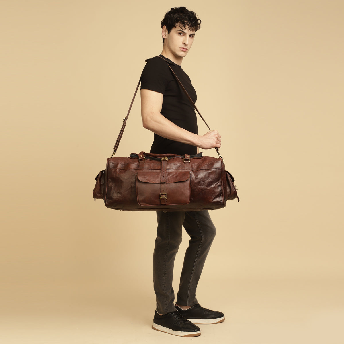 stylish Model with Red leather duffle bag