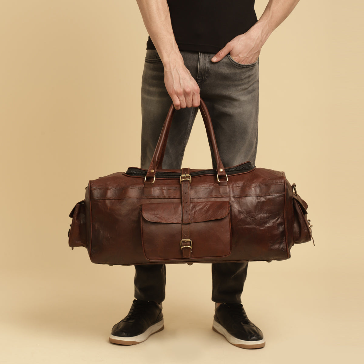 Model with red  leather duffle bag 